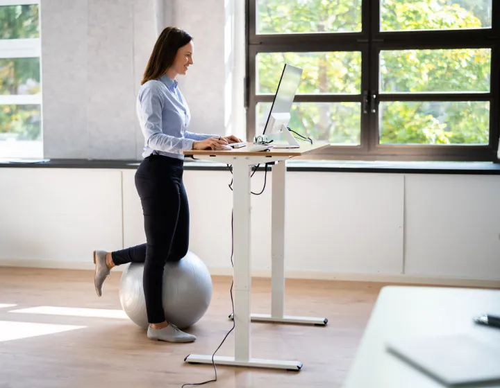 Woman working at a standing desk